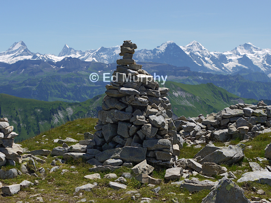 The Furggengütsch summit cairn and the Bernese Oberland peaks