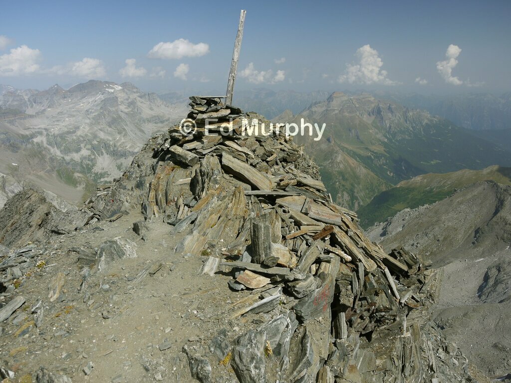 The Wasenhorn's summit cairn with Italian summits to the east