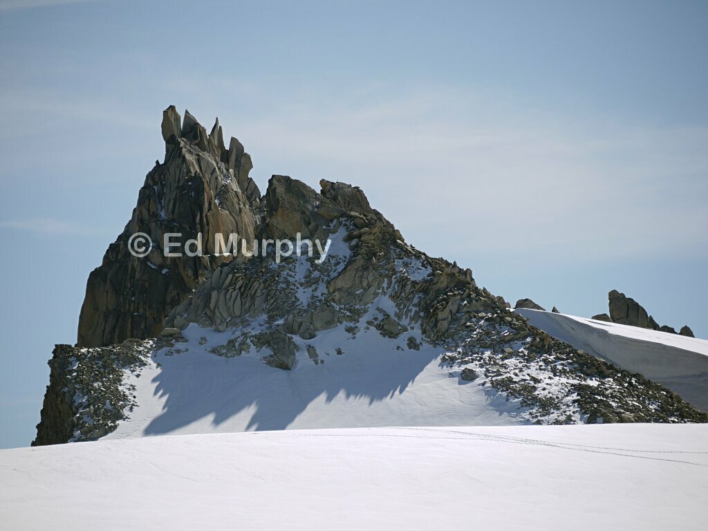 A pinnacle of the Aiguilles Dorées across the Trient Ice Plateau