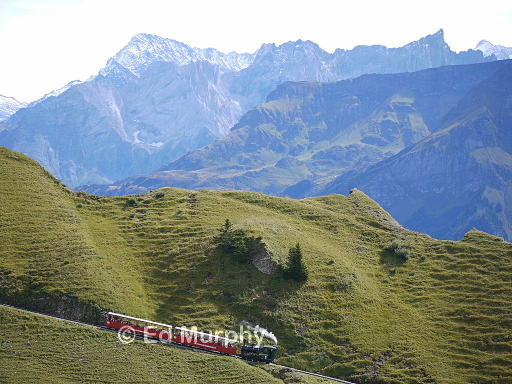 The Brienzer Rothornbahn train below the Dirrengrind ridge