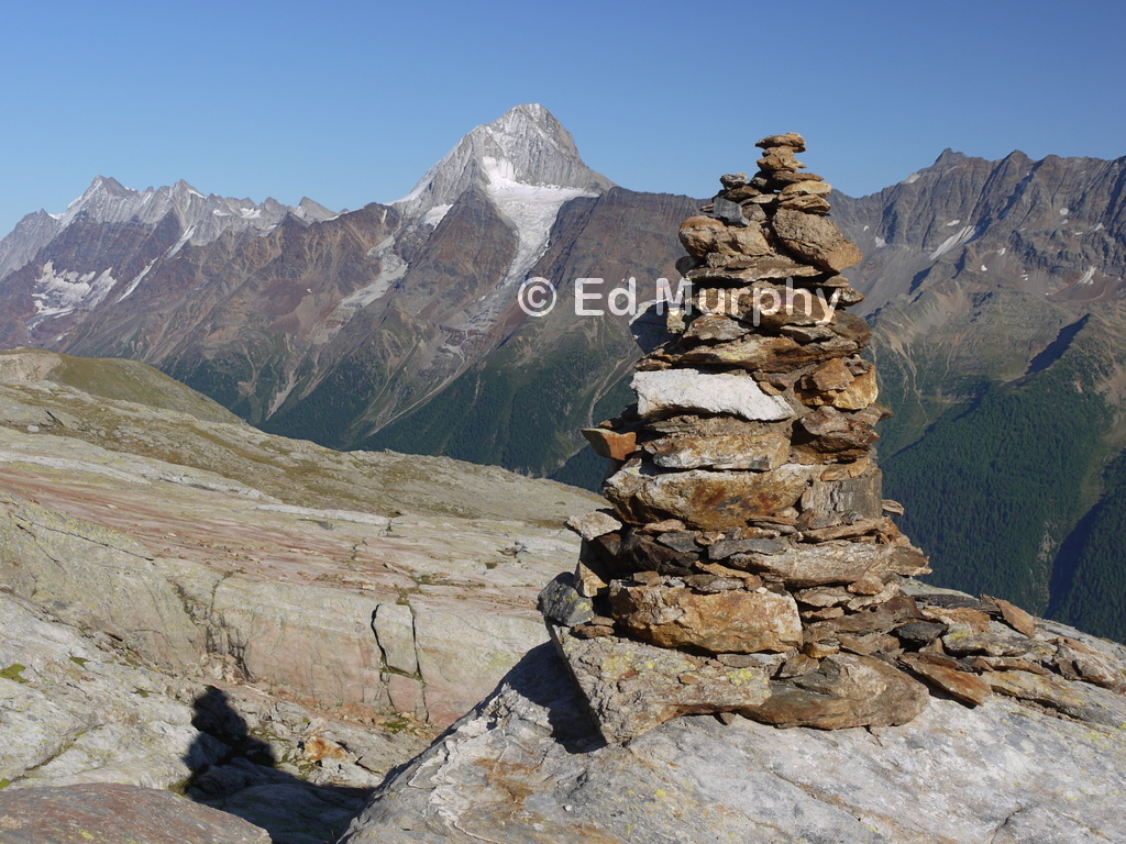 Cairn at the Lötschen Pass with a view to the Bietschhorn