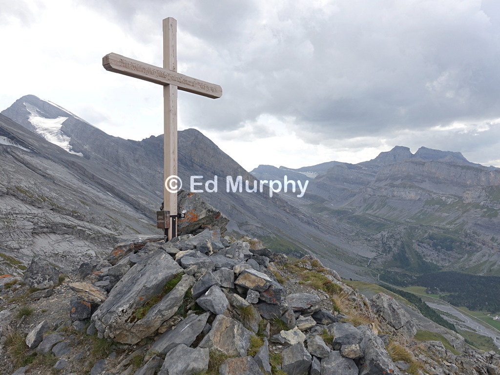 The Lower Tatelishorn's modern summit cross with the Rinderhorn behind
