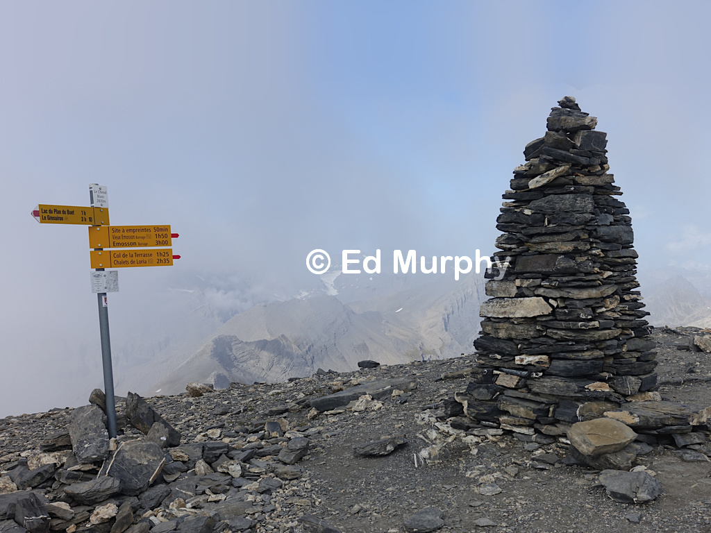 The Cheval Blanc's summit signpost and monster cairn