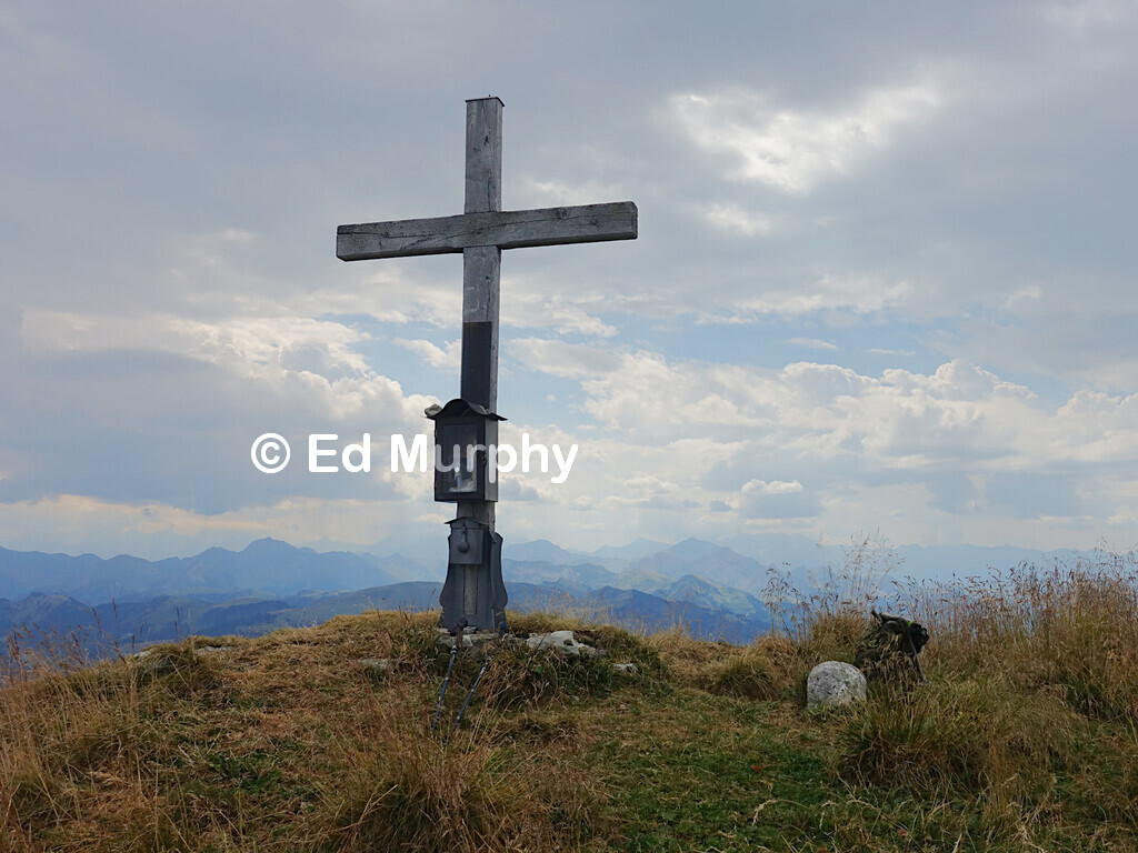 The Widdergalm's summit cross and the Western Bernese Alps in hazy weather