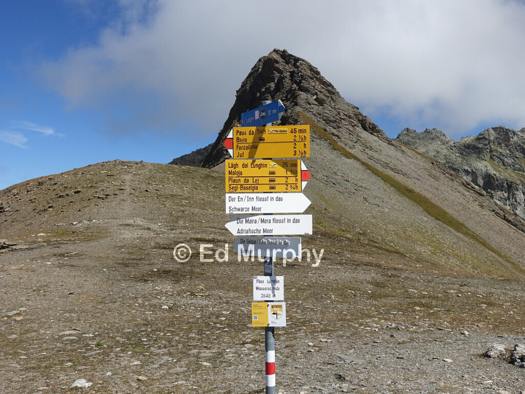 The triple watershed marker on the Lunghin Pass